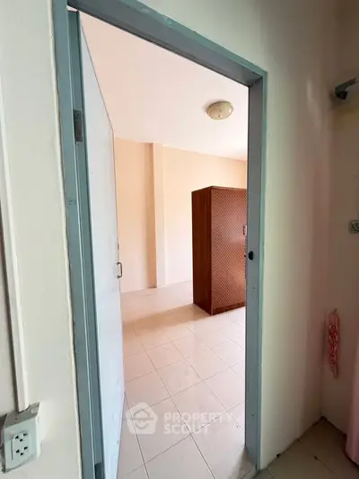 Spacious room with tiled flooring and natural light, perfect for versatile use.