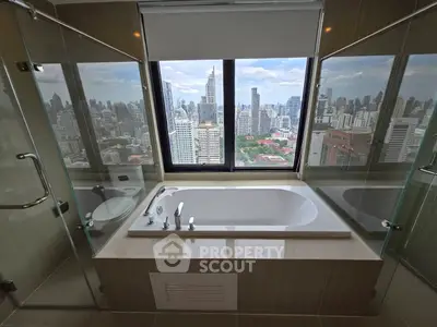Luxurious bathroom with city skyline view and modern bathtub