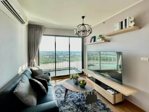 Modern living room with balcony and stunning view, featuring sleek furniture and stylish decor.