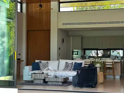 Luxurious open-plan living room with modern kitchen and stylish decor