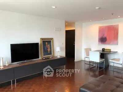 Spacious living room with modern decor and elegant parquet flooring