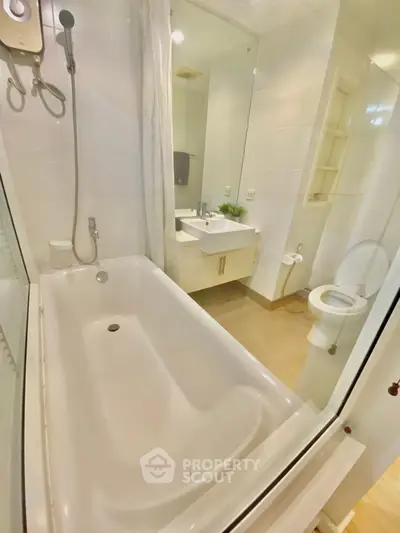 Modern bathroom with bathtub and sleek fixtures in a bright, clean design.