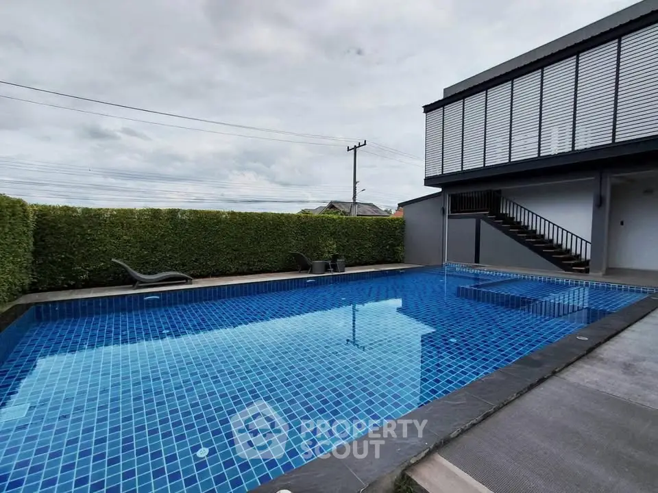 Luxurious modern home with private swimming pool and stylish outdoor area.