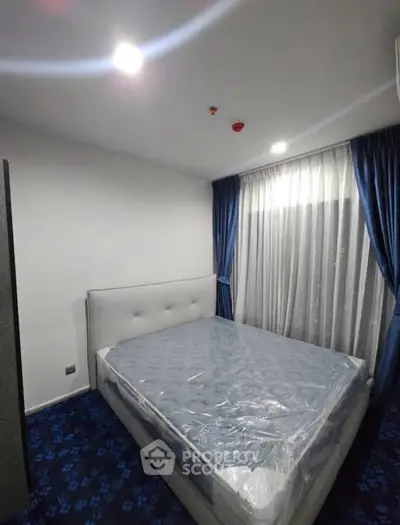 Modern bedroom with plush carpet and elegant curtains