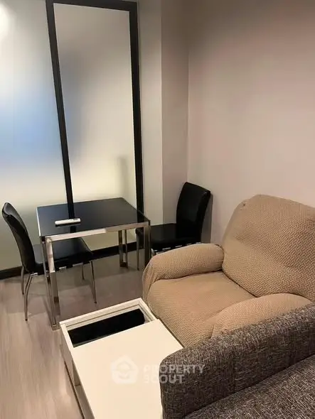 Cozy living room with modern furniture and sleek dining area