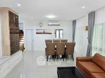Spacious modern living room with elegant dining area and stylish decor