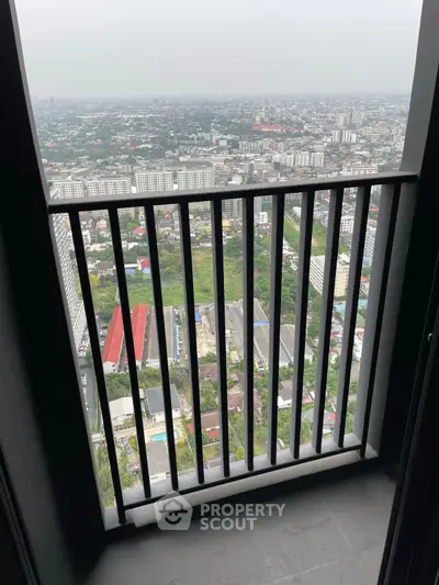 Stunning high-rise balcony view overlooking cityscape with expansive skyline.