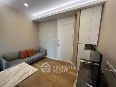 Modern living room with sleek design, featuring a cozy sofa and stylish TV unit, perfect for urban living.