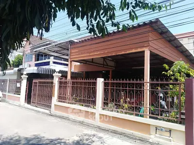 Charming residential property with spacious carport and secure fencing in a serene neighborhood.
