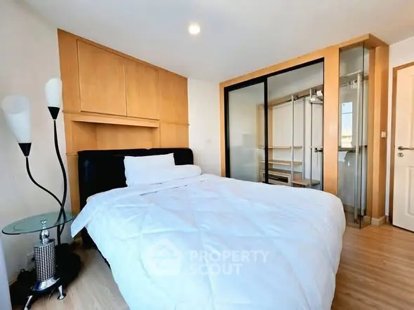 Modern bedroom with stylish decor and ample storage space