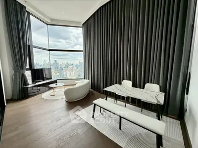 Luxurious modern living room with panoramic city view and elegant furnishings