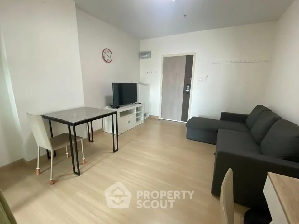 Modern living room with sleek furniture and minimalist design, perfect for urban living.