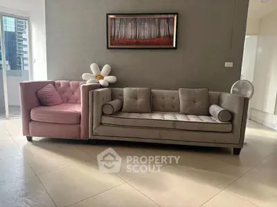 Stylish living room with modern sofas and elegant wall art, perfect for contemporary urban living.