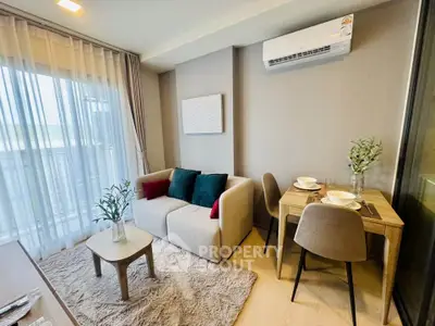 Cozy modern living room with dining area and air conditioning
