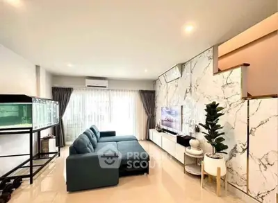 Spacious modern living room with stylish decor and large windows