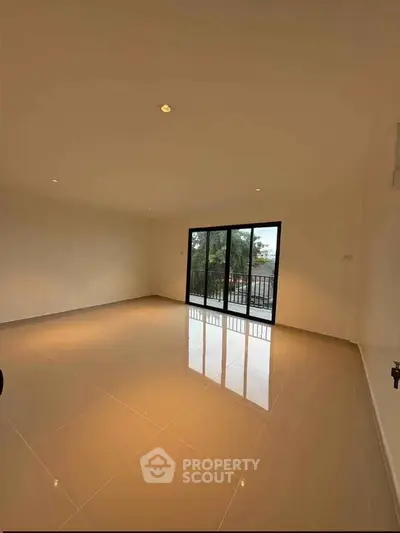 Spacious empty living room with large windows and glossy tiled floor, perfect for customization.