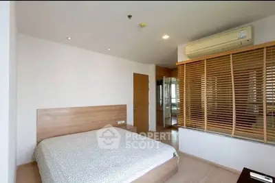 Spacious bedroom with modern design and air conditioning in a contemporary apartment.