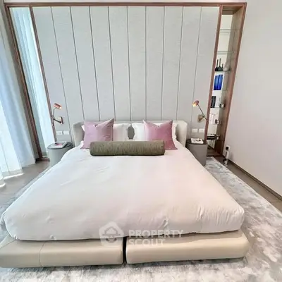 Luxurious modern bedroom with elegant decor and plush bedding