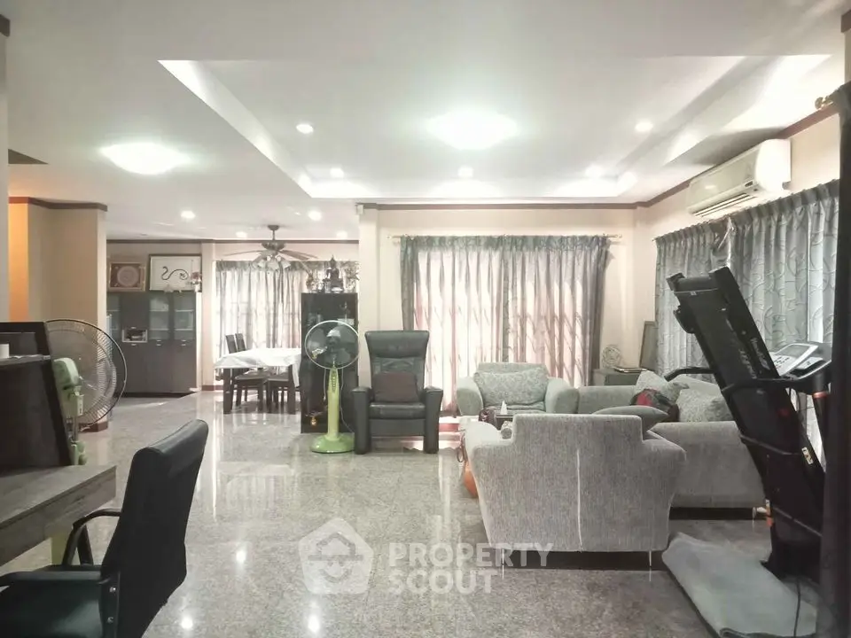 Spacious living room with modern furniture and natural light
