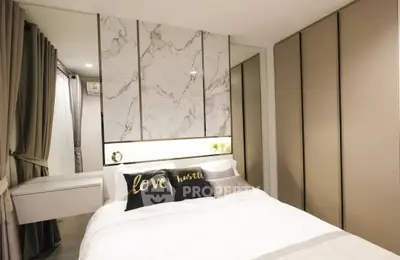 Modern bedroom with stylish decor and ample closet space