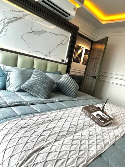 Luxurious bedroom with elegant decor and plush bedding