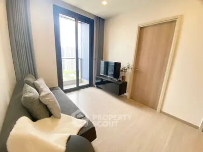 Modern living room with balcony view and sleek furnishings