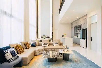 Luxurious modern living room with high ceilings and elegant decor