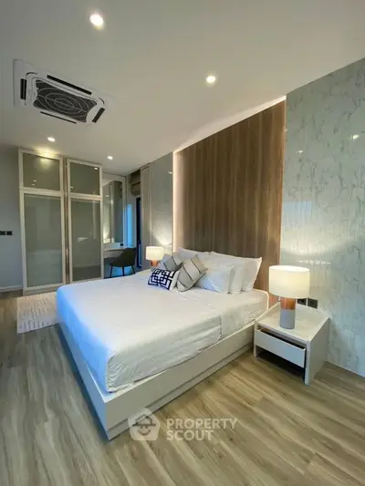 Luxurious modern bedroom with stylish decor and ambient lighting