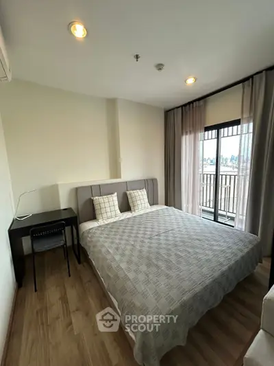 Modern bedroom with balcony view and stylish decor