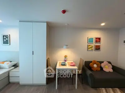 Modern studio apartment with cozy living area and stylish decor