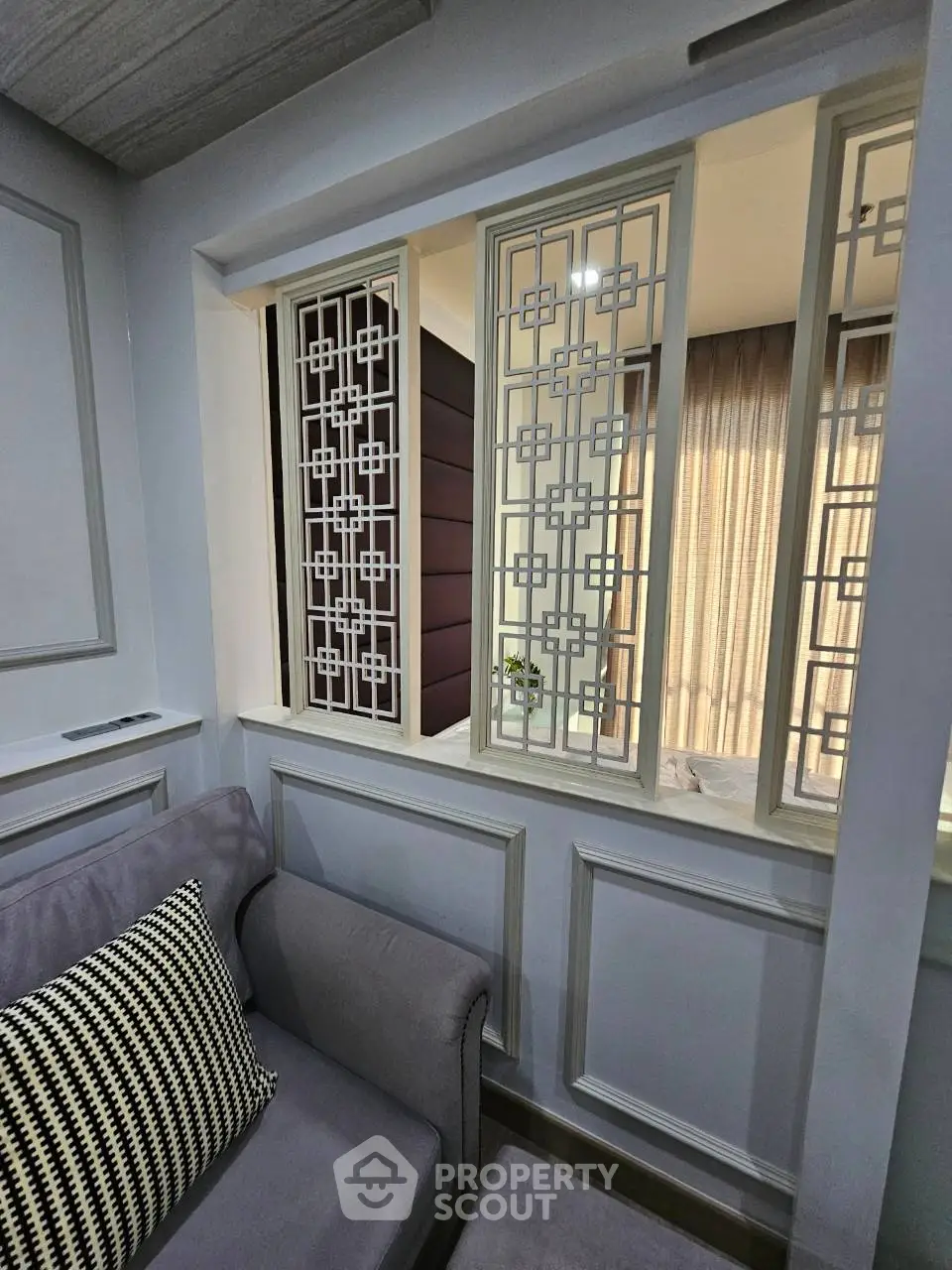 Elegant living room with stylish partition and cozy seating area