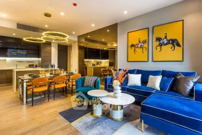 Luxurious modern living room with vibrant decor and open kitchen layout