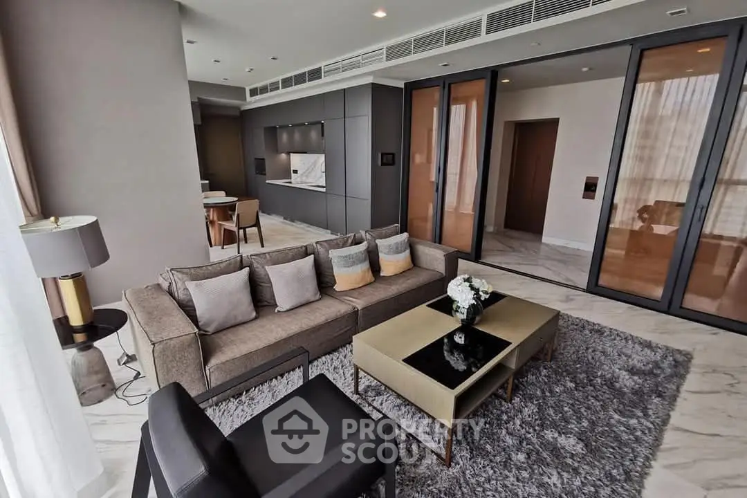 Luxurious modern living room with open kitchen and elegant decor