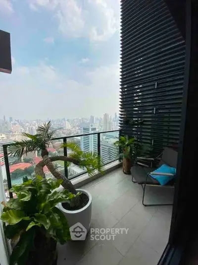 Stunning balcony with panoramic city view and lush greenery