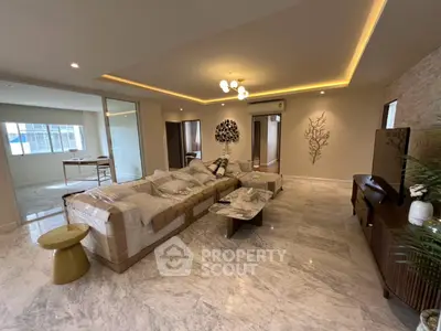 Spacious modern living room with marble flooring and elegant decor
