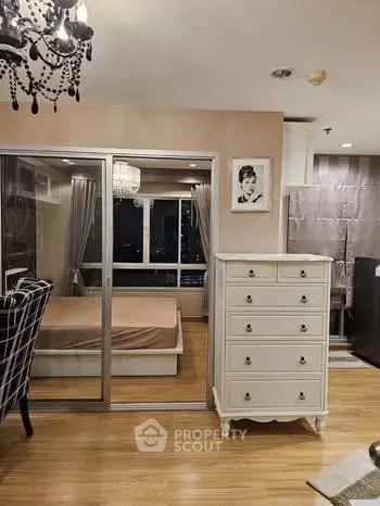 Chic modern bedroom with elegant decor and large windows offering city views.