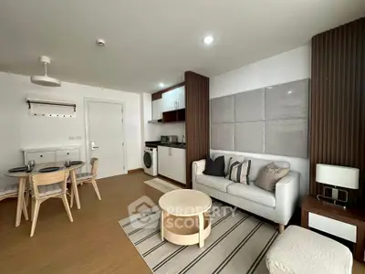 Modern living room with open kitchen and stylish decor