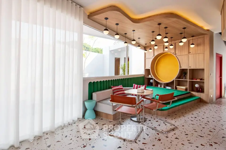 Modern living room with unique ceiling design and stylish furniture