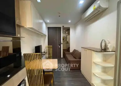 Modern apartment interior with sleek furniture and efficient layout, featuring a cozy living area and stylish dining space.