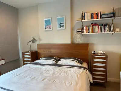 Cozy bedroom with modern wooden furniture and stylish decor, perfect for relaxation and comfort.