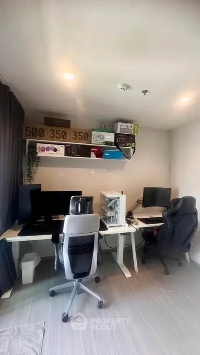 Modern home office with dual computer setup and sleek design