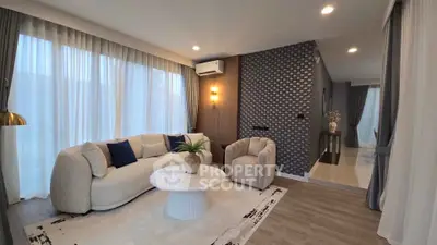 Elegant living room with modern decor and cozy seating area