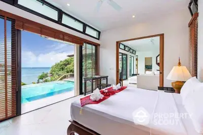 Luxurious bedroom with stunning ocean view and private pool access