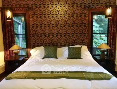 Luxurious bedroom with elegant wallpaper and cozy lighting