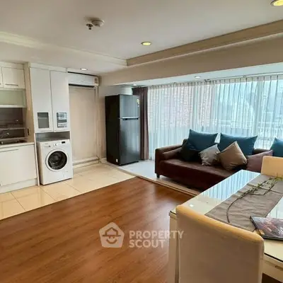 Spacious living room with modern appliances and city view, perfect for urban living.