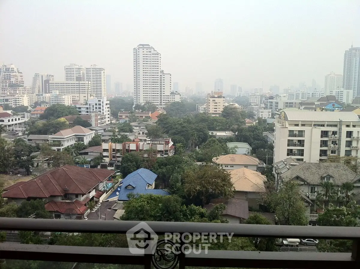 Stunning cityscape view from a high-rise balcony showcasing urban living and skyline.