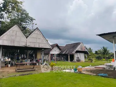 Charming rural property with traditional architecture and lush green surroundings, perfect for a serene lifestyle.