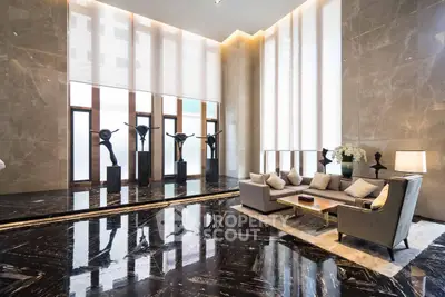 Luxurious modern living room with high ceilings and elegant marble flooring.