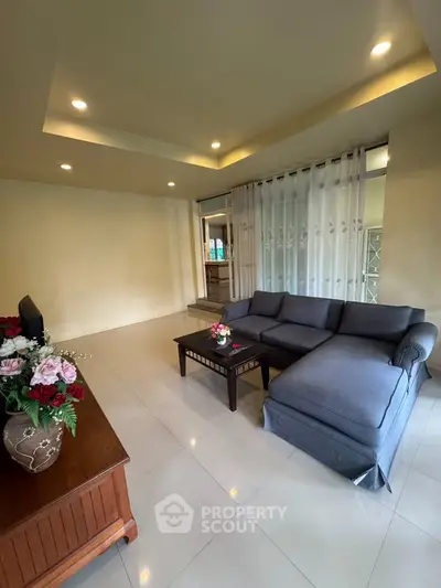 Spacious living room with modern sofa and elegant decor