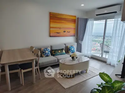 Modern living room with stylish decor and stunning balcony view